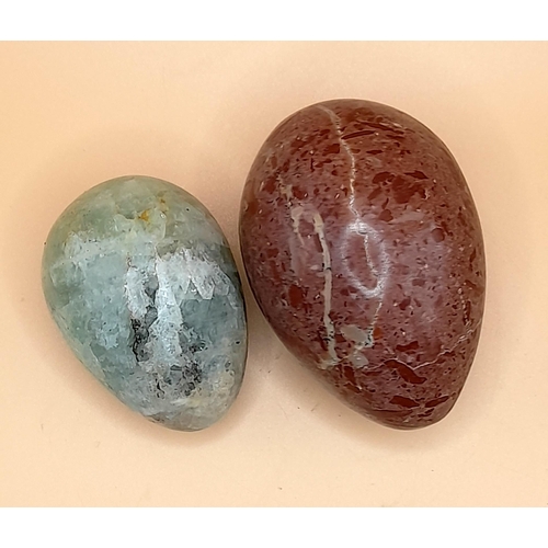 348 - A Large Collection of Stone and Glass Decorative Eggs. 10 in Total.