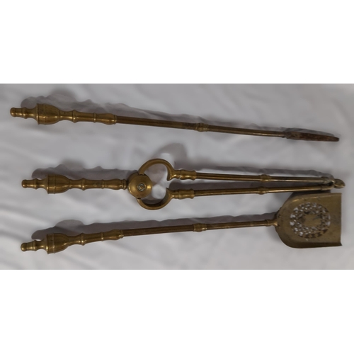 359 - A Complete Set Of Victorian Brass Fire Irons including a Shovel, Tongs and Poker. approx. 61cm in L.