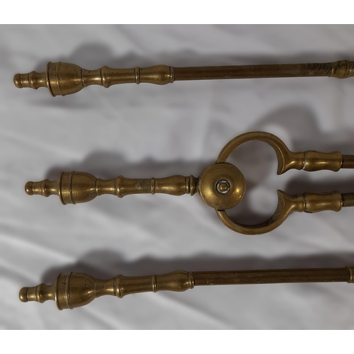 359 - A Complete Set Of Victorian Brass Fire Irons including a Shovel, Tongs and Poker. approx. 61cm in L.