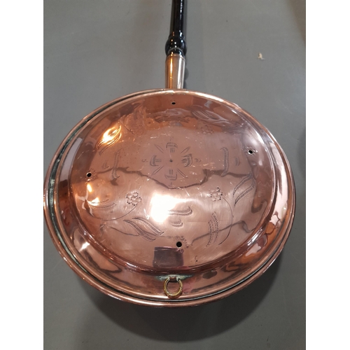 361 - A Pair of Antique Copper Bed Warming Pans with Decoration and Wooden Handles. Approx 105cm L.