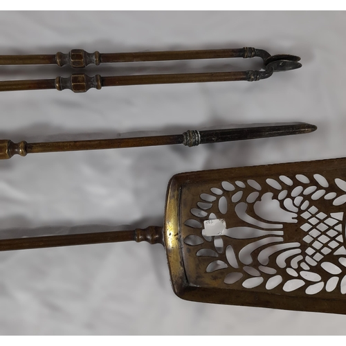 366 - A Set of Three Antique Fire Irons with Decorative Knobs. A Shovel, Set of Tongs and a Poker. 67cm L.