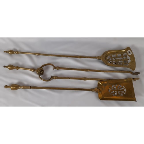 373 - 3 Antique Brass Fire Irons, 2 Decorative Shovels and a Pair of Tongs.