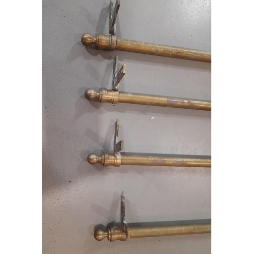 379 - A Set of 4 Antique Brass Trolley Legs with Castors.