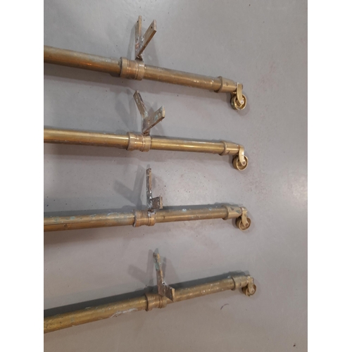 379 - A Set of 4 Antique Brass Trolley Legs with Castors.