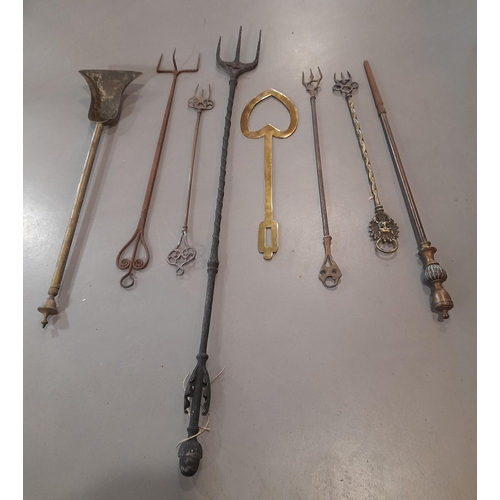 380 - A Collection of Antique Brass Fire Irons including Toasting Forks, 2 Shovels and a Heart Shaped Cook... 