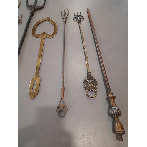 380 - A Collection of Antique Brass Fire Irons including Toasting Forks, 2 Shovels and a Heart Shaped Cook... 