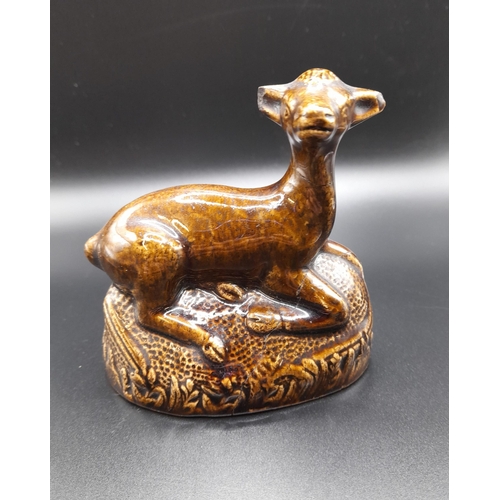 223A - A Group Of Animal Figurines including a Treacle Glaze Deer, A Camel, Horse and A Gilt Decorated Deer... 