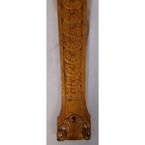 556 - A Gold Painted, Hard Wood Wall Hanging of A Carved Lady with Decoration. 66cm Length.