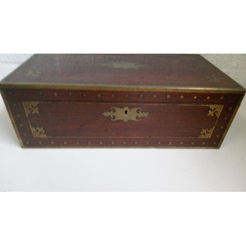 2 - A Mahogany Brass Bound and decorated writing slope. 17cm high,51cm wide,27cm deep.