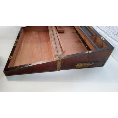 2 - A Mahogany Brass Bound and decorated writing slope. 17cm high,51cm wide,27cm deep.