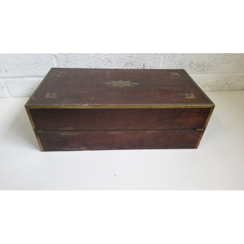 2 - A Mahogany Brass Bound and decorated writing slope. 17cm high,51cm wide,27cm deep.