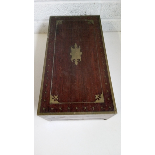 2 - A Mahogany Brass Bound and decorated writing slope. 17cm high,51cm wide,27cm deep.