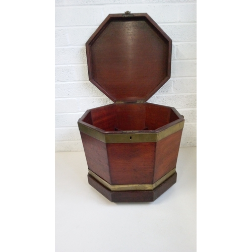 741 - A Mahogany Glass Bound Wine Cooler with wooden
sectional interior on Brass castors.
48cm high, 55x55... 