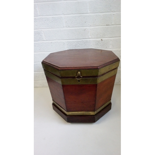 741 - A Mahogany Glass Bound Wine Cooler with wooden
sectional interior on Brass castors.
48cm high, 55x55... 