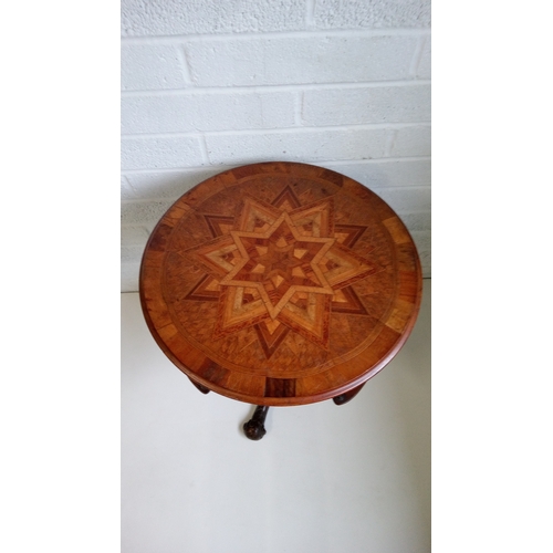 8 - A Victorian Inlaid parquetry centre table, with carved tripod base.
70cm high,58x58cms.