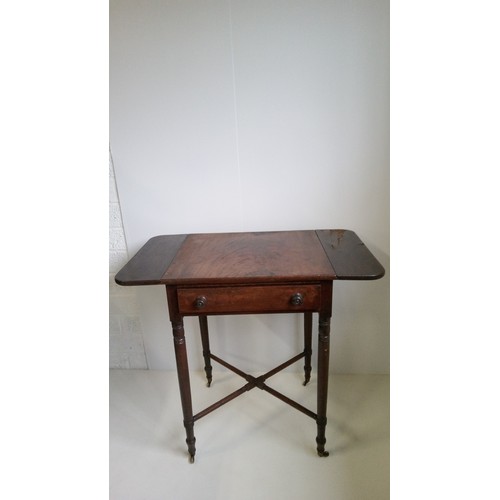 749 - A small regency Pembroke drop leaf work/lamp table with drawer on turned legs with cross stretcher. ... 