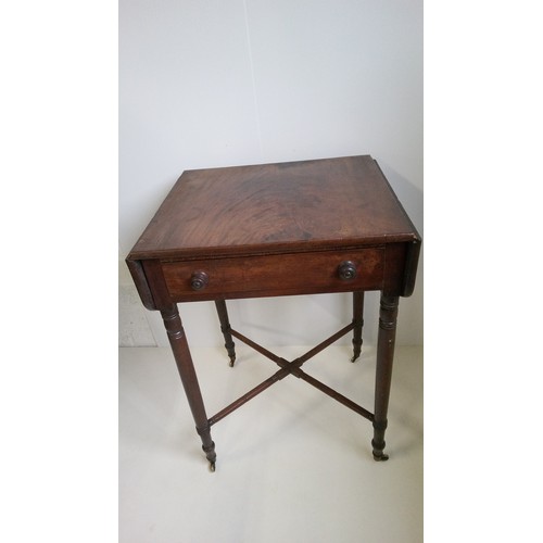 749 - A small regency Pembroke drop leaf work/lamp table with drawer on turned legs with cross stretcher. ... 