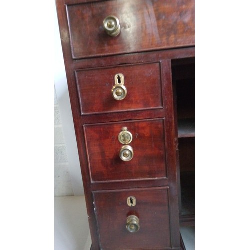 756 - A 7 Drawer Mahogany Desk With Brass Handles, Centre Cupboard And Brass Galley.
80cm High,82cm Wide,4... 