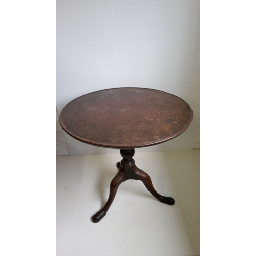 757 - A Round Tilt Top Table With Turned Column And Tripod Legs.