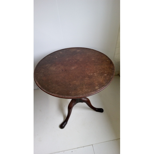 757 - A Round Tilt Top Table With Turned Column And Tripod Legs.