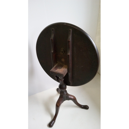 757 - A Round Tilt Top Table With Turned Column And Tripod Legs.