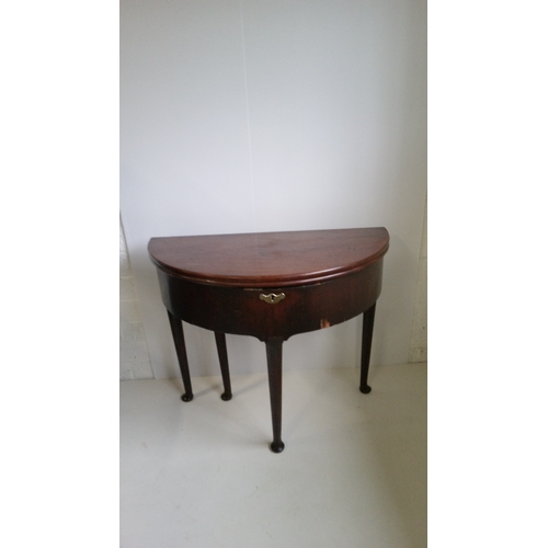 763 - A Mahogany Fold Over Table On Pad Feet In Need Of Repair To Back leg As Pictured.
74cm High,89cm Wid... 