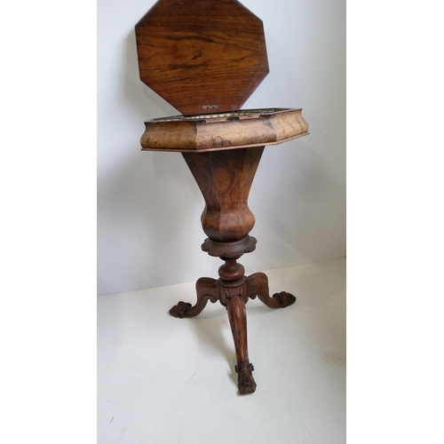 766 - A Victorian Walnut Octagonal Sewing Table On Carved Tripod Legs, Lid 
 Needs Attention.
78cm High, 4... 