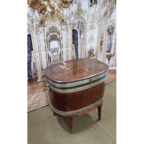 404 - Georgian oval mahogany wine cooler of coopered construction, body and lid with 3 bands of brass.
On ... 