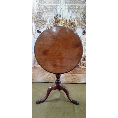 410 - Tilt top table on tripod base, with scalloped motif.
68cm diameter height folded 107cm overall heigh... 