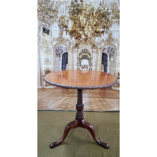 410 - Tilt top table on tripod base, with scalloped motif.
68cm diameter height folded 107cm overall heigh... 