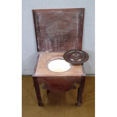 437 - A Mahogany Commode with ceramic liner and hinged rectangular top.
Damaged as pictured.
48cm high, 50... 