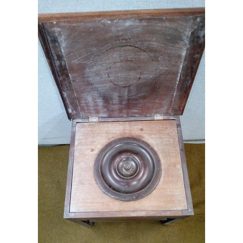 437 - A Mahogany Commode with ceramic liner and hinged rectangular top.
Damaged as pictured.
48cm high, 50... 