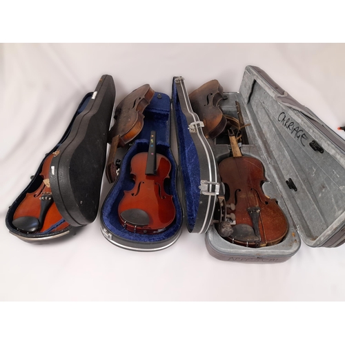 543 - A Collection of Five Violins in Varying states of disrepair. Three with Cases, none with bows. Broke... 