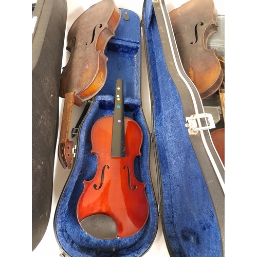 543 - A Collection of Five Violins in Varying states of disrepair. Three with Cases, none with bows. Broke... 