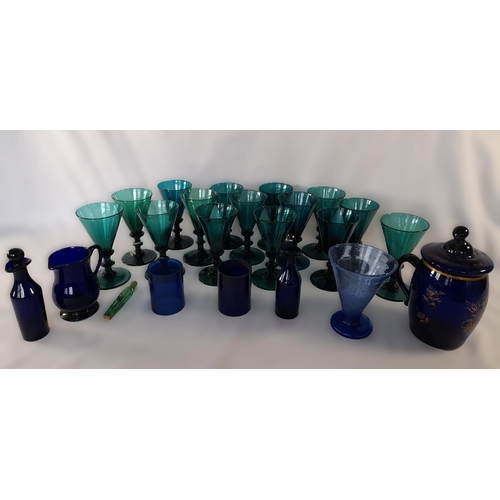 71A - A Selection of Coloured Glassware in Greens and Blues including Goblets,Small Decanters, Jug, A Lidd... 