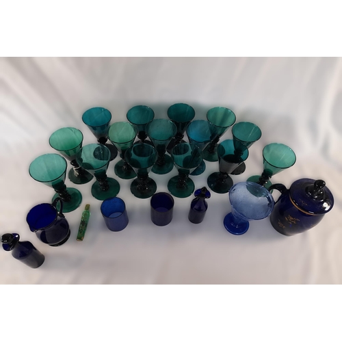 71A - A Selection of Coloured Glassware in Greens and Blues including Goblets,Small Decanters, Jug, A Lidd... 