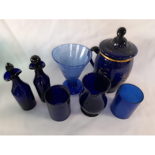 71A - A Selection of Coloured Glassware in Greens and Blues including Goblets,Small Decanters, Jug, A Lidd... 