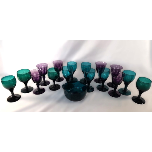 71B - A Collection of Green and Amethyst Glass Goblets and a Green Glass Bowl, the Amethyst Glasses having... 