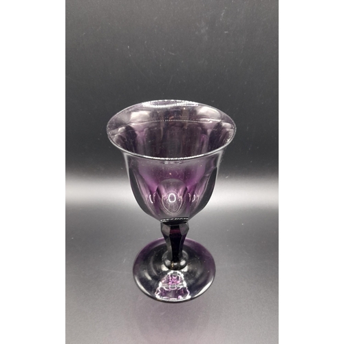 71B - A Collection of Green and Amethyst Glass Goblets and a Green Glass Bowl, the Amethyst Glasses having... 