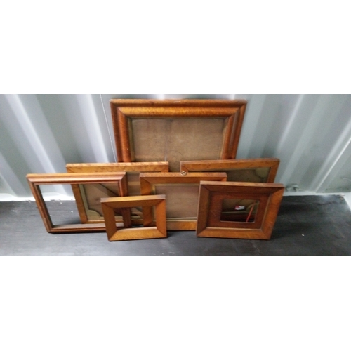 1289 - 7 x Light Wood Picture Frames, Largest Measures 64cm High, 54cm Wide.