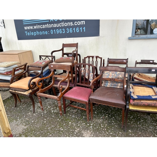 1273 - A Large Collection of Mismatched Antique Chairs and Seats.