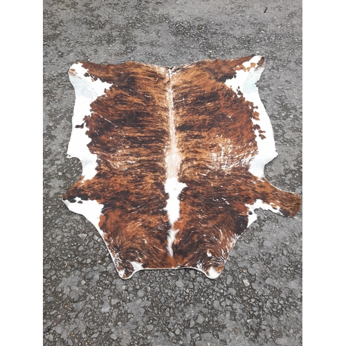 118B - A Large Cowhide Rug.