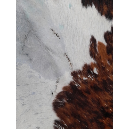 118B - A Large Cowhide Rug.