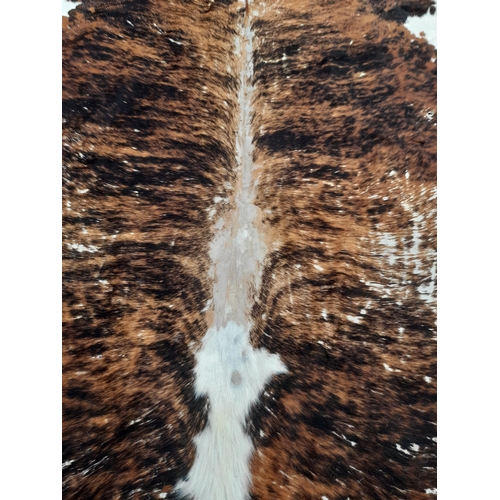 118B - A Large Cowhide Rug.