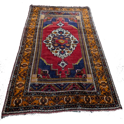 117 - A Handmade Persian Carpet 274 x 182cm. 

NB. Slight Fray on One Corner.