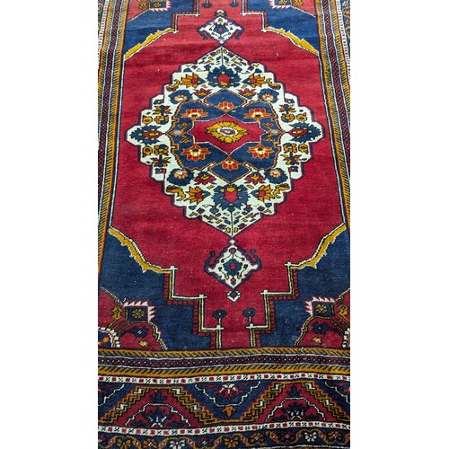 117 - A Handmade Persian Carpet 274 x 182cm. 

NB. Slight Fray on One Corner.