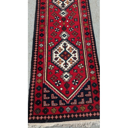 118 - An Indian Kamedan Carpet Runner. 70 x 290cm.