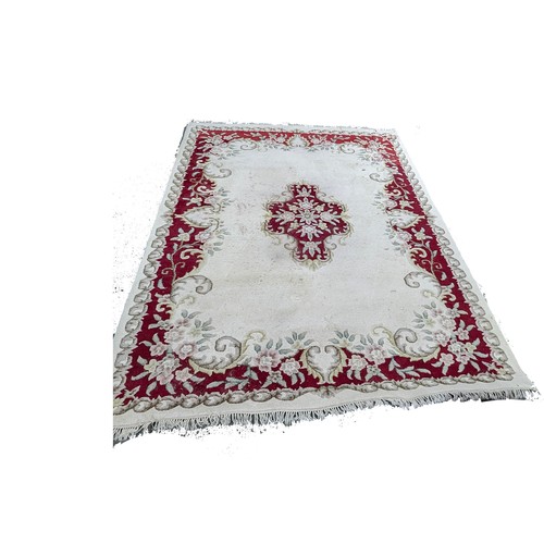 118A - A Large Wool Rug with some wear. 276 x 366cm.