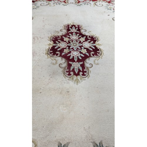 118A - A Large Wool Rug with some wear. 276 x 366cm.