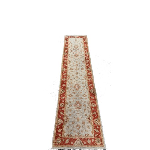 122 - A Handmade Carpet Runner, 335 x 78cm.